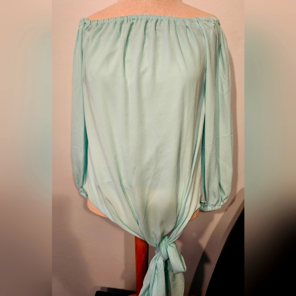 Woman's Julian Chang top M and a Large available.